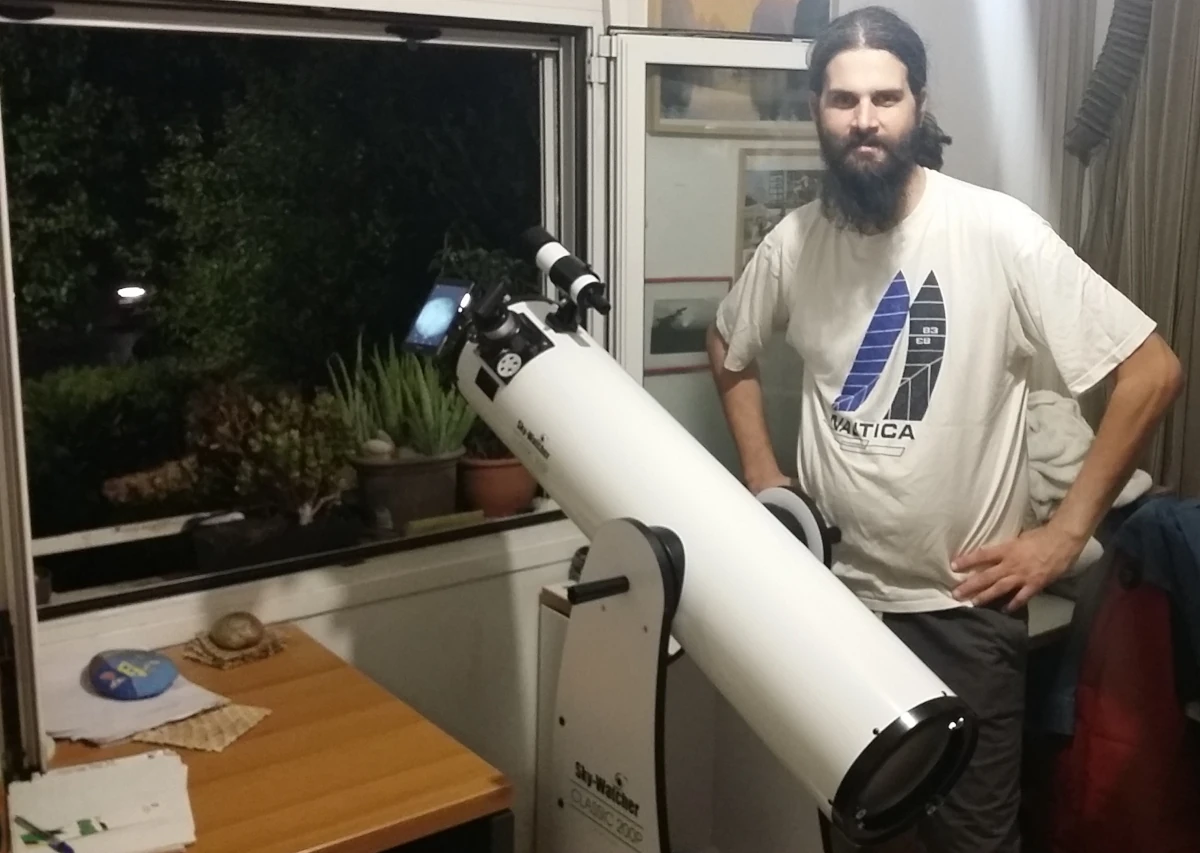 My 8" Dobsonian Telescope Sky Watcher pointing out of my window, and my self (self-portrait).